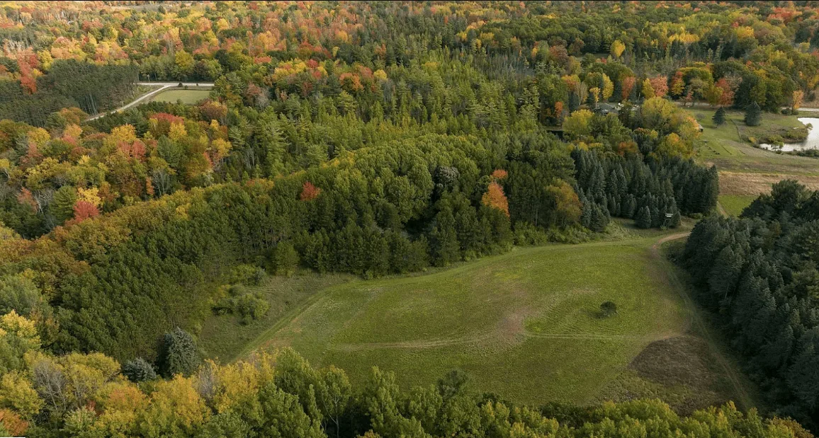 Aerial autumn view across the property and neighboring countryside